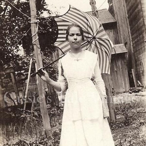 Early 1900s Vintage Photo - Backyard Runway Model, Girl in a White Dress with a Striped Umbrella