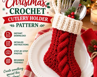 May include: A red crochet stocking cutlery holder with a white ribbed cuff, featuring a central cable knit design. The stocking contains a silver fork, knife, and spoon, accented with a small sprig of green pine needles and red berries.