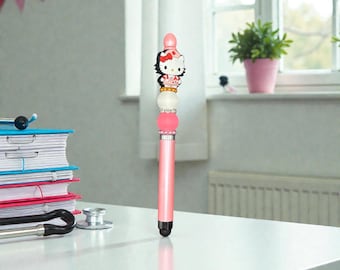 Bolígrafo con forma de enfermera rosa y detalles de cuentas