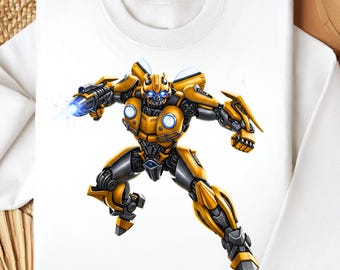 May include: White sweatshirt featuring a detailed illustration of a yellow and gray robot character with blue eyes and a weapon firing a blue energy blast. The robot is in a dynamic pose, suggesting action.