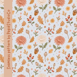 May include: A seamless pattern on a light blue background featuring illustrations of orange and white chrysanthemums, brown acorns, yellow leaves, red berries, and dried seed pods. A vertical tan bar on the left contains the text Seamless pattern by PagiéStudioCo.