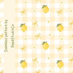 May include: A seamless pattern featuring yellow lemons, white daisies, and yellow ribbons on a light yellow and white gingham background. The text "Seamless pattern by PagiéStudioCo" is printed vertically in green on the left side of the image.