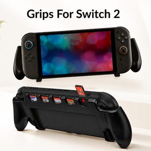 May include: A black handheld gaming console grip with the text Grips For Switch 2. The top view shows the console screen, while the bottom view displays the back of the grip with five slots for game cartridges, one of which is partially inserted.
