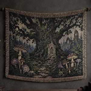 May include: A rectangular woven wall tapestry featuring a large, dark, ancient tree with a stone archway at its base. The scene includes clusters of mushrooms, purple flowers, and a forest background with a stone path, finished with fringed edges.
