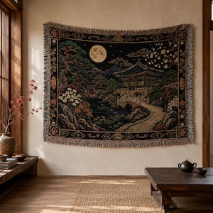 Korean palace tapestry wall hanging on a white background, showing a moonlit traditional garden with tiled pavilion, stone bridge, pond, pine tree, white blossoms, mountains, woven texture, and fringed edges.