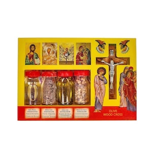 May include: A yellow box set featuring religious icons, small glass jars with red lids, and an olive wood cross. The jars contain holy water, soil, olive oil, and incense. The set includes images of Jesus and other religious figures.