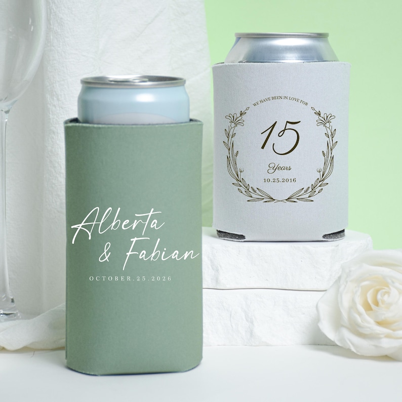 May include: A white ceramic mug with a black handle and the text "But First, Coffee" in a bold, black font. The mug is set against a blurred background, suggesting a cozy setting.