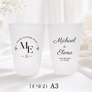 May include: Two frosted plastic cups with custom text and wedding details. One cup has "YOUR CUSTOM TEXT" and "ME" with the date "April 25 2026". The other cup says "Michael & Elena" and "SAVE THE DATE 04.25.2026".