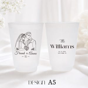 May include: Two frosted plastic cups with wedding details. One cup features a line drawing of a bride and groom with the names "Frank & Anna" and the date "April 25, 2026." The other cup has "The Williams" and the same date and location.