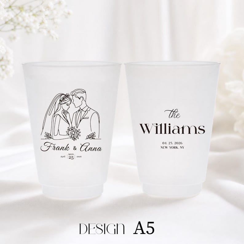 May include: Two frosted plastic cups with wedding details. One cup features a line drawing of a bride and groom with the names "Frank & Anna" and the date "April 25, 2026." The other cup has "The Williams" and the same date and location.