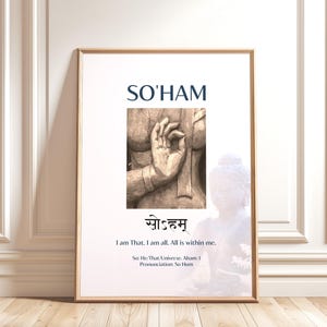 May include: A framed print with the text "SO'HAM" in navy blue, above an illustration of a hand gesture. Below the illustration is text in a foreign language and the English translation, "I am That. I am all. All is within me."