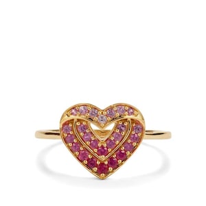 May include: A gold ring with a double heart design, set with pink and red gemstones. The ring has a slender band and a polished finish. The ring is suitable for everyday wear or special occasions.