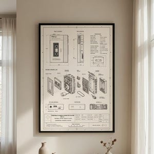 May include: A framed technical drawing print featuring an exploded view and schematics of a portable stereo cassette player. The black and white diagram includes detailed component labels, side elevations, and specifications on a light beige background.
