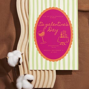 May include: A Galentine's Day invitation card with a pink oval design and orange trim, set against a green and white striped background. The card includes the text "Join us for a romantic dinner" and "Monday, September 15 at 8 PM".