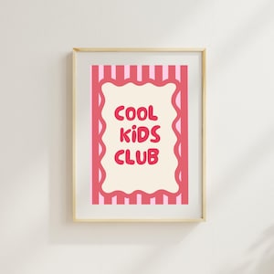 May include: A framed wall art print featuring a cream-colored central scalloped rectangle with the red text COOL KIDS CLUB. The background consists of vertical pink and white stripes, all enclosed within a light-toned wooden frame.