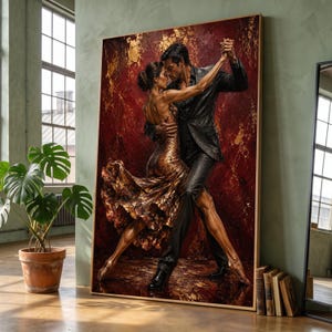 May include: A large rectangular wall art print depicting a couple dancing tango. The person on the left wears a shimmering gold dress with a flared skirt, while the person on the right wears a dark suit. The background is a deep red with gold accents.