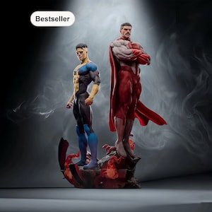May include: Two superhero action figures. One figure is in a black, blue, and yellow suit, and the other is in a red and white suit with a red cape. The figures are standing on a rocky base with a fiery design.