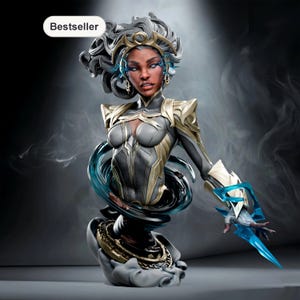 May include: A detailed bust of a female figure with gray hair and a gold headpiece. The figure wears a black and gold armored suit with blue accents. A blue energy swirl surrounds the figure, and the word "Bestseller" is in the top left corner.