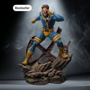 May include: A blue and yellow Cyclops action figure in a dynamic pose, with a red visor and a determined expression. The figure stands on a detailed, rocky base with a metallic structure. The word "Bestseller" is in a white oval.