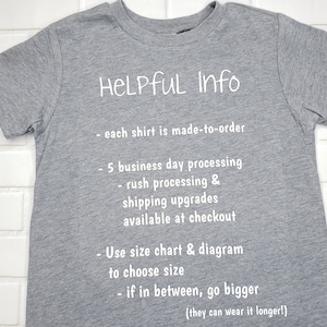 May include: A heather gray t-shirt with white text that reads "HELPFUL Info" followed by bullet points about the product. The shirt is made-to-order, with a 5-business-day processing time. Size charts are available.