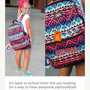 May include: A pink, blue, and black backpack with a geometric pattern. The backpack has a zippered pocket on the front and a small tag with the letter "E" on it. The backpack also has the word "Justice" printed on the front and the name "Brynn" printed on the bottom.