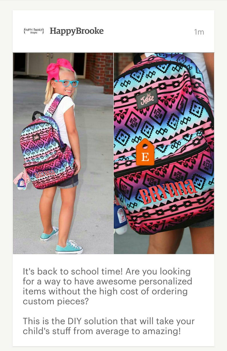 May include: A pink, blue, and black backpack with a geometric pattern. The backpack has a zippered pocket on the front and a small tag with the letter "E" on it. The backpack also has the word "Justice" printed on the front and the name "Brynn" printed on the bottom.