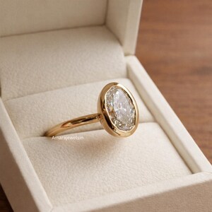 lab grown diamond ring
oval bezel engagement ring
2 carat lab diamond ring
bezel set diamond ring
cathedral engagement ring
IGI certified lab diamond
oval lab diamond solitaire
yellow gold bezel ring
minimalist engagement ring
modern bezel ring
low profile diamond ring
ethical diamond ring
lab diamond ring
gifts for women
gifts for her
gifts for sister
custom ring
cluster diamond ring
demi fine jewelry
elegant jewelry
timeless jewelry
minimalist ring
fine jewelry
proposal ring
signet ring