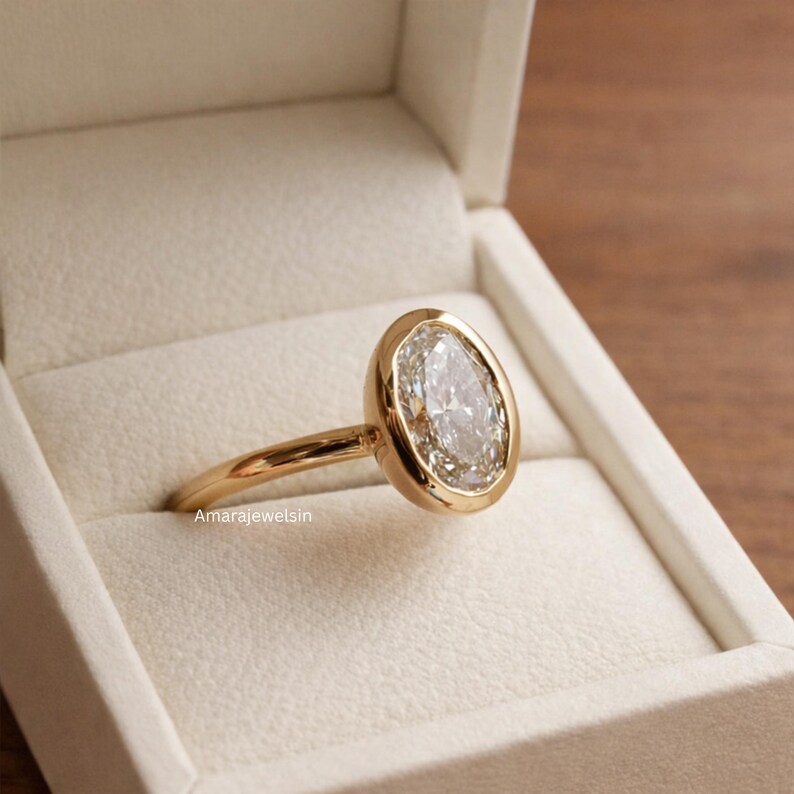 lab grown diamond ring
oval bezel engagement ring
2 carat lab diamond ring
bezel set diamond ring
cathedral engagement ring
IGI certified lab diamond
oval lab diamond solitaire
yellow gold bezel ring
minimalist engagement ring
modern bezel ring
low profile diamond ring
ethical diamond ring
lab diamond ring
gifts for women
gifts for her
gifts for sister
custom ring
cluster diamond ring
demi fine jewelry
elegant jewelry
timeless jewelry
minimalist ring
fine jewelry
proposal ring
signet ring