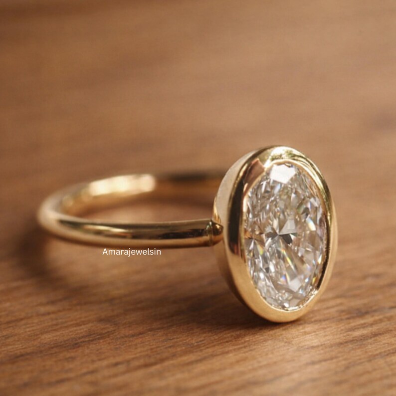 lab grown diamond ring
oval bezel engagement ring
2 carat lab diamond ring
bezel set diamond ring
cathedral engagement ring
IGI certified lab diamond
oval lab diamond solitaire
yellow gold bezel ring
minimalist engagement ring
modern bezel ring
low profile diamond ring
ethical diamond ring
lab diamond ring
gifts for women
gifts for her
gifts for sister
custom ring
cluster diamond ring
demi fine jewelry
elegant jewelry
timeless jewelry
minimalist ring
fine jewelry
proposal ring
signet ring