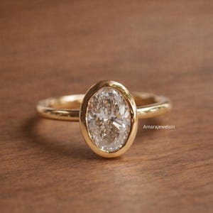 lab grown diamond ring
oval bezel engagement ring
2 carat lab diamond ring
bezel set diamond ring
cathedral engagement ring
IGI certified lab diamond
oval lab diamond solitaire
yellow gold bezel ring
minimalist engagement ring
modern bezel ring
low profile diamond ring
ethical diamond ring
lab diamond ring
gifts for women
gifts for her
gifts for sister
custom ring
cluster diamond ring
demi fine jewelry
elegant jewelry
timeless jewelry
minimalist ring
fine jewelry
proposal ring
signet ring
