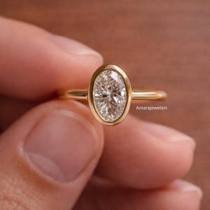 lab grown diamond ring
oval bezel engagement ring
2 carat lab diamond ring
bezel set diamond ring
cathedral engagement ring
IGI certified lab diamond
oval lab diamond solitaire
yellow gold bezel ring
minimalist engagement ring
modern bezel ring
low profile diamond ring
ethical diamond ring
lab diamond ring
gifts for women
gifts for her
gifts for sister
custom ring
cluster diamond ring
demi fine jewelry
elegant jewelry
timeless jewelry
minimalist ring
fine jewelry
proposal ring
signet ring
