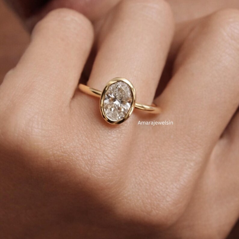 lab grown diamond ring
oval bezel engagement ring
2 carat lab diamond ring
bezel set diamond ring
cathedral engagement ring
IGI certified lab diamond
oval lab diamond solitaire
yellow gold bezel ring
minimalist engagement ring
modern bezel ring
low profile diamond ring
ethical diamond ring
lab diamond ring
gifts for women
gifts for her
gifts for sister
custom ring
cluster diamond ring
demi fine jewelry
elegant jewelry
timeless jewelry
minimalist ring
fine jewelry
proposal ring
signet ring