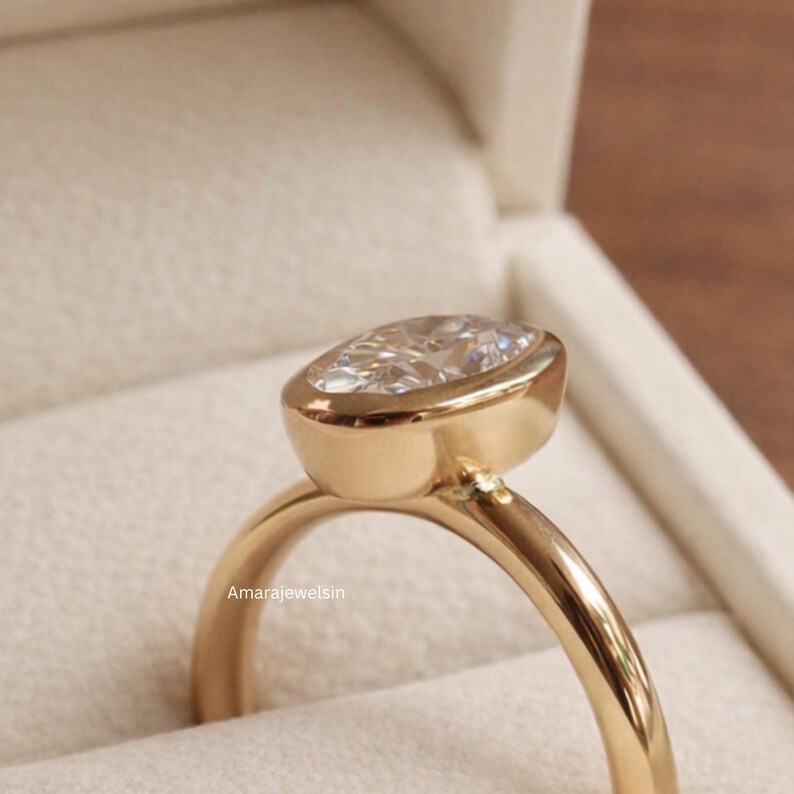 lab grown diamond ring
oval bezel engagement ring
2 carat lab diamond ring
bezel set diamond ring
cathedral engagement ring
IGI certified lab diamond
oval lab diamond solitaire
yellow gold bezel ring
minimalist engagement ring
modern bezel ring
low profile diamond ring
ethical diamond ring
lab diamond ring
gifts for women
gifts for her
gifts for sister
custom ring
cluster diamond ring
demi fine jewelry
elegant jewelry
timeless jewelry
minimalist ring
fine jewelry
proposal ring
signet ring
