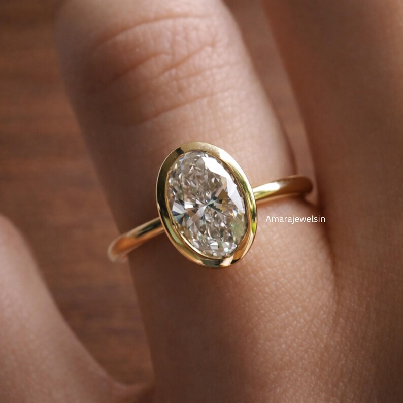 lab grown diamond ring
oval bezel engagement ring
2 carat lab diamond ring
bezel set diamond ring
cathedral engagement ring
IGI certified lab diamond
oval lab diamond solitaire
yellow gold bezel ring
minimalist engagement ring
modern bezel ring
low profile diamond ring
ethical diamond ring
lab diamond ring
gifts for women
gifts for her
gifts for sister
custom ring
cluster diamond ring
demi fine jewelry
elegant jewelry
timeless jewelry
minimalist ring
fine jewelry
proposal ring
signet ring