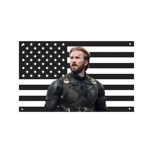 May include: A rectangular metal sign featuring a black and white American flag background with a centered image of a bearded man in a dark tactical suit with a star emblem on the chest and a small red mark on his forehead, with four corner holes.