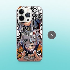 May include: Clear phone case featuring a colorful anime-style graphic. The design includes the text "SOUL EATER" and a character illustration with a gray and white color scheme. The case has a clear border and a light blue background.