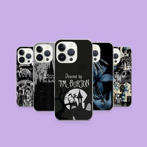 May include: A collection of phone cases featuring designs inspired by Tim Burton's films. The cases display various graphics, including a haunted house, a spider, and the text "Directed by Tim Burton". The cases are black and white.