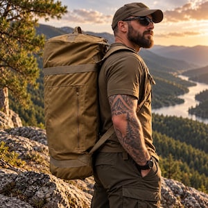 May include: A large, cylindrical, tan-colored tactical duffel bag with a vertical zippered pocket on the side, worn as a backpack with adjustable straps. The bag is made of a durable, solid-colored fabric and features reinforced webbing.