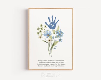 May include: A framed print featuring a blue handprint above a watercolor bouquet of blue, white, and green flowers. The print includes a poem about love and a Valentine's message. The artwork is in a wooden frame.