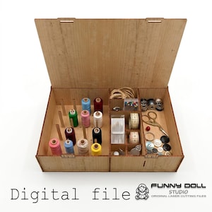 May include: A wooden sewing organizer box with an open lid, featuring vertical pegs for thread spools in various colors, and divided compartments containing sewing needles, metal bobbins, a measuring tape, scissors, and assorted buttons.