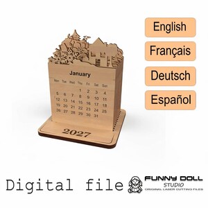 May include: A wooden 2027 calendar with a January display. The calendar features a laser-cut design of a house and trees at the top. The words "January" and "2027" are visible. The image also includes the words "Digital file".