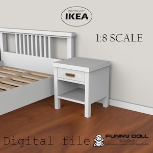 May include: A white nightstand with a drawer and open shelf, featuring a gold-colored handle. The nightstand is part of a digital file inspired by IKEA, labeled as 1:8 scale. The image also includes a bed frame and the text "Digital file".