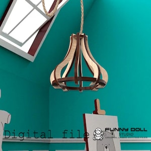 May include: A wooden pendant light fixture with a layered design, suspended from a rope. The light fixture has a natural wood and dark brown color scheme. The background is a teal wall with a window and a drawing.