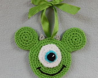 Hand crocheted Holiday Christmas Ornament Mickey Mouse Ears Monster Inc like Green One eyed monster Mike with Ribbon