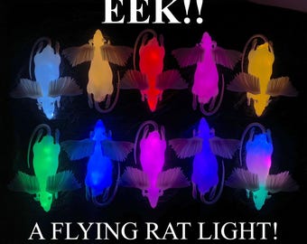 Eita, uma luz de rato voador! ...uma lâmpada radiante e alada