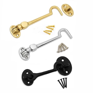 May include: Three cabin hooks in gold, silver, and black. Each hook has a matching mounting plate and screws. The gold hook is at the top, the silver in the middle, and the black at the bottom. These hooks are used for securing doors or windows.
