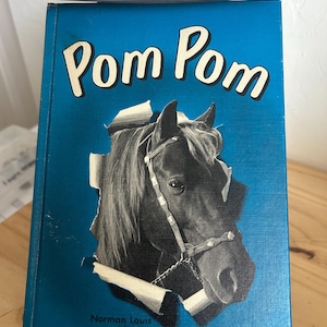 Pom Pom de Louis Schutter y Norma Youngberg ~ 1965 Historia "Buck" Weaver Libro infantil