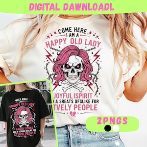 May include: A white t-shirt featuring a skull graphic with pink hair and the text "COME HERE I AM A HAPPY OLD LADY." A second black t-shirt shows a similar skull graphic and the text "WALK AWAY I AM A GRUMPY OLD LADY."