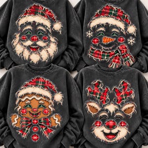 May include: Four charcoal gray crewneck sweatshirts featuring distressed-style applique patches of Christmas characters: a Santa Claus, a snowman, a gingerbread person, and a reindeer, all accented with red and green plaid fabric details.