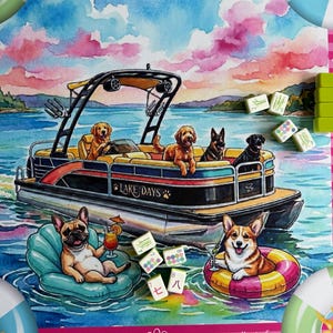 May include: A colorful game mat featuring a watercolor illustration of dogs on a pontoon boat labeled Lake Days, with a French Bulldog and a Corgi floating in the water on inflatable rings, surrounded by scattered mahjong tiles and pink clouds.